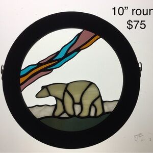 This stained glass bear is the icon of the north.